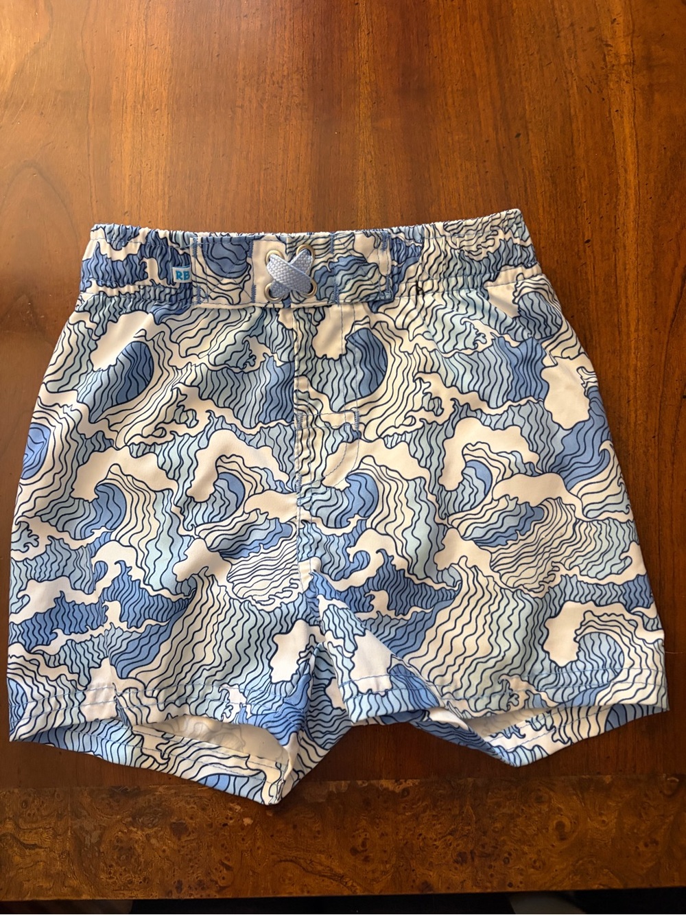 Boys Blue Wave-Print Swim Trunks
